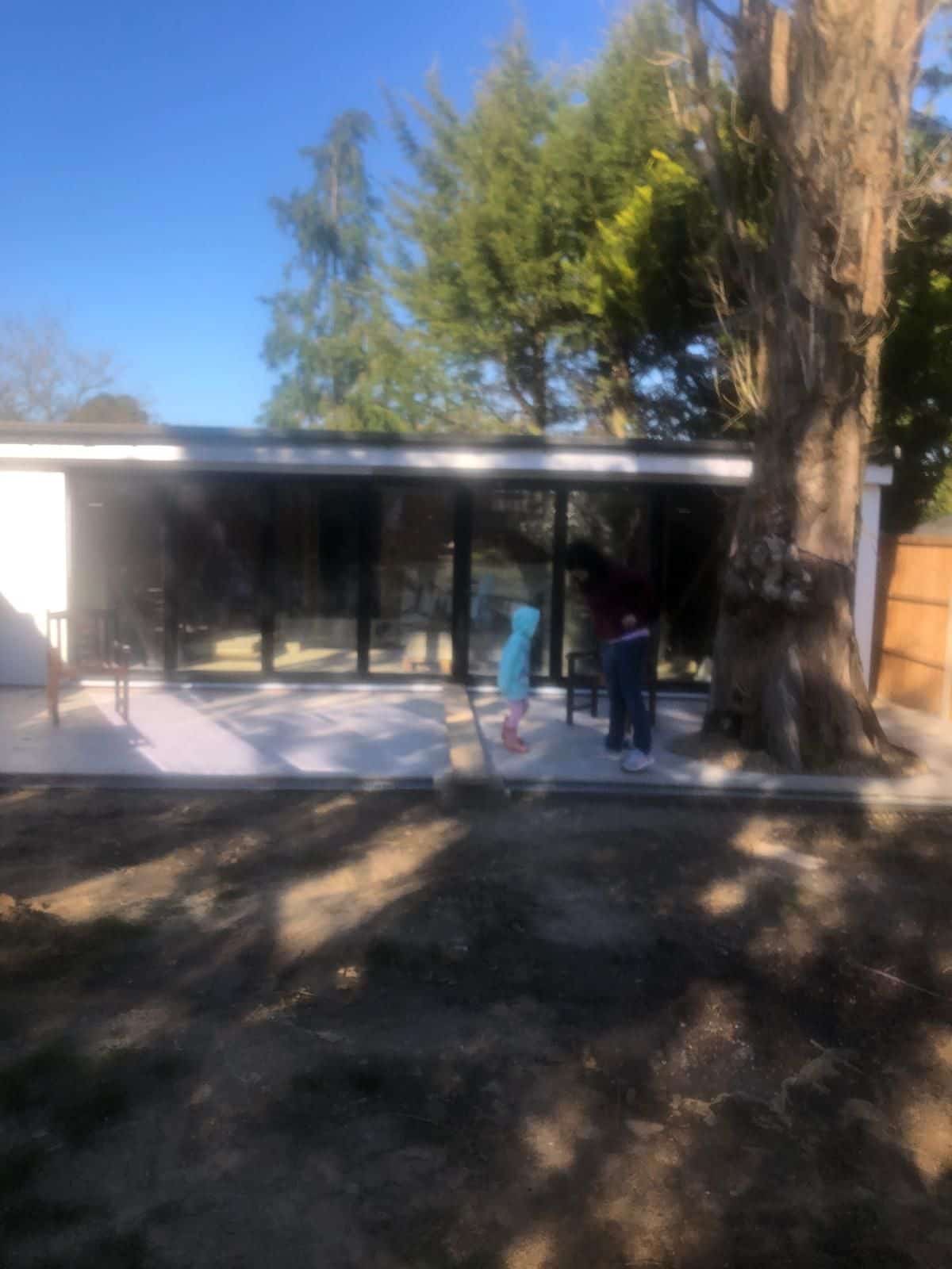 The 55 m² garden building, with bifold doors onto the garden