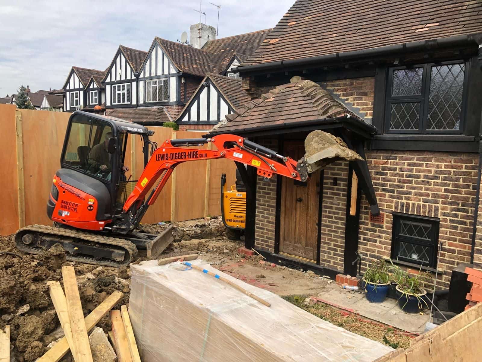 Excavating beside the house for the wraparound extension