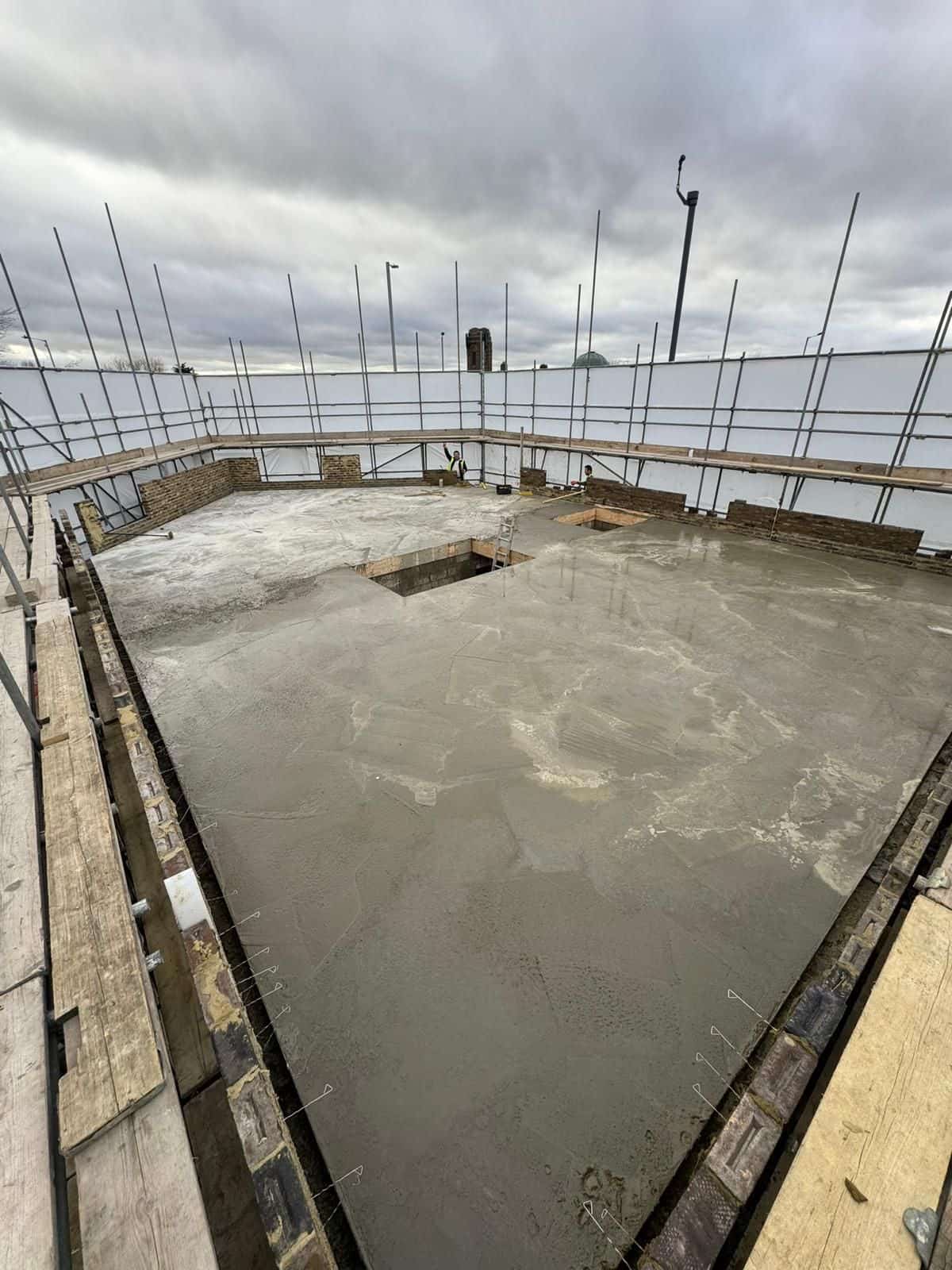 A freshly poured concrete floor slab